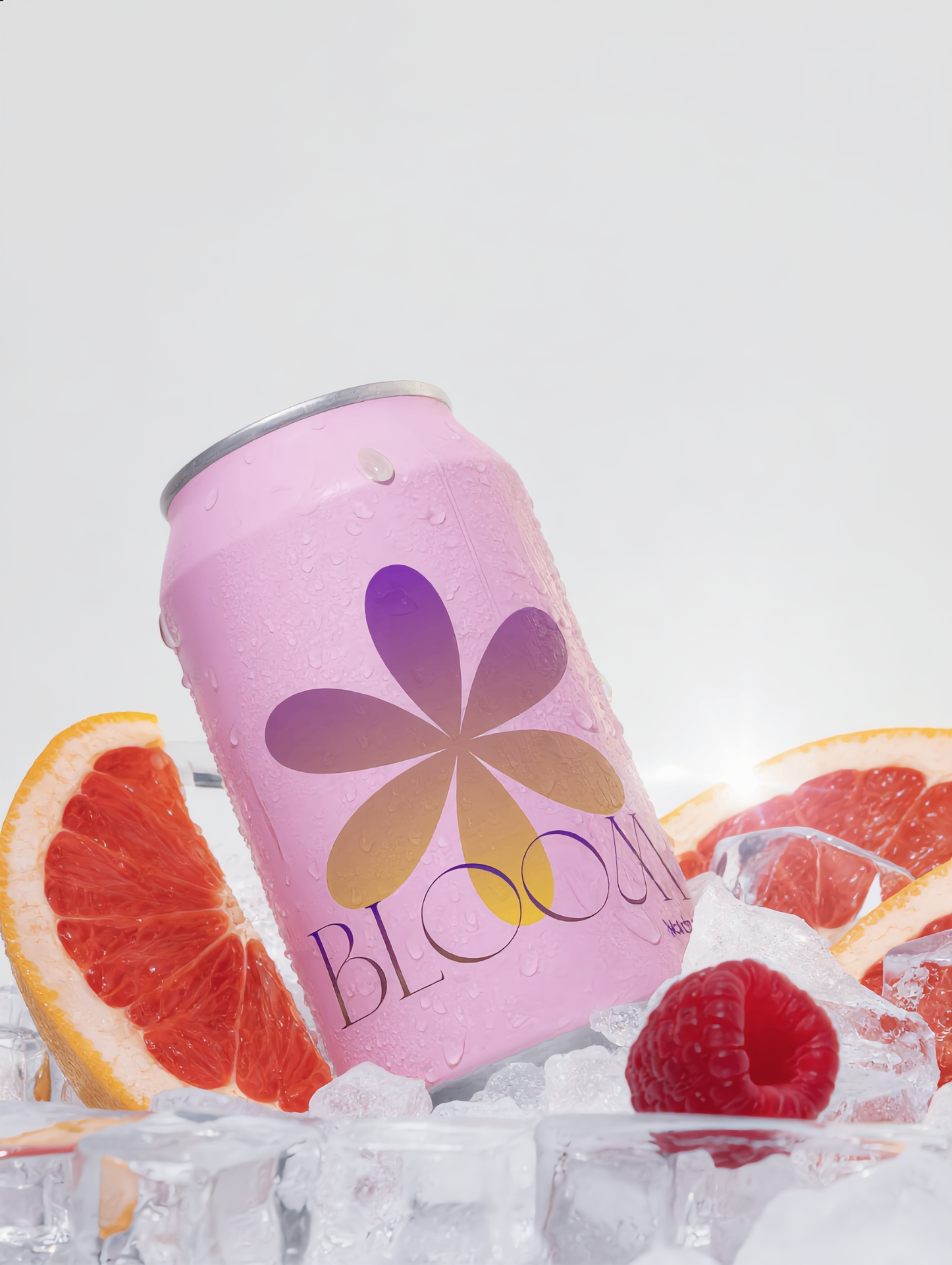 Bloom pink can on ice with grapefruit and raspberries